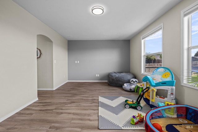5174 N Rothmans Ave, Boise, ID 83713 - playroom featuring wood finished floors and arched walkways