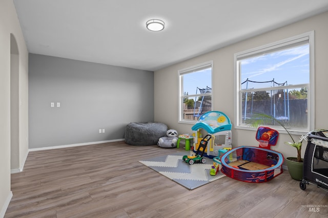 5174 N Rothmans Ave, Boise, ID 83713 - game room featuring wood finished floors and arched walkways
