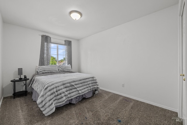 5174 N Rothmans Ave, Boise, ID 83713 - bedroom featuring baseboards and dark carpet