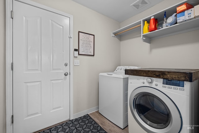 5174 N Rothmans Ave, Boise, ID 83713 - laundry area with washer and clothes dryer and light wood finished floors