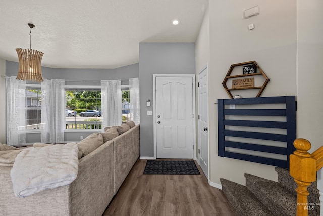 5174 N Rothmans Ave, Boise, ID 83713 - foyer with dark wood-style flooring and a textured ceiling