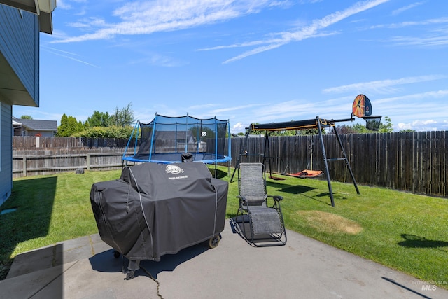 5174 N Rothmans Ave, Boise, ID 83713 - fenced backyard featuring a trampoline, a patio area, and area for grilling