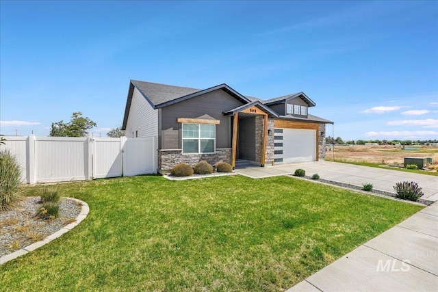 503 April Ave, Twin Falls, ID 83301 - view of front of property featuring driveway, stone siding, and a gate