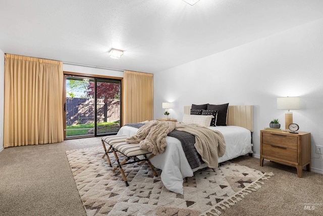 carpeted bedroom with access to exterior