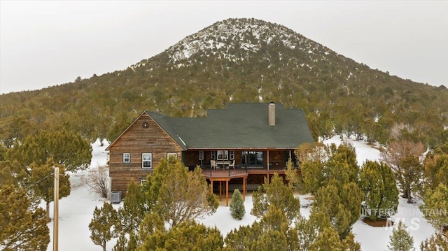 birds eye view of property with a mountain view