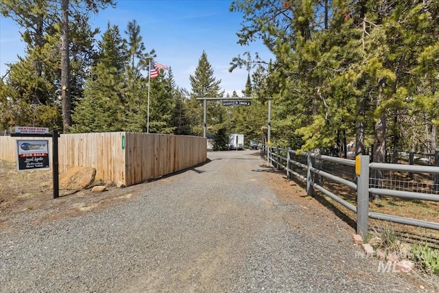 view of street with gravel driveway