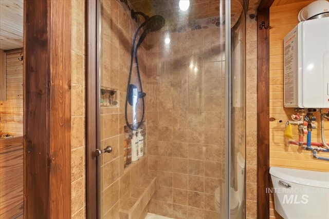 full bath with toilet, a shower stall, and water heater