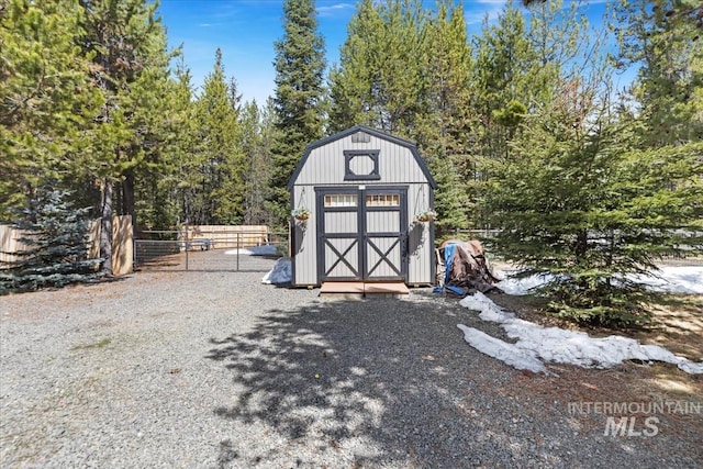 view of shed with fence