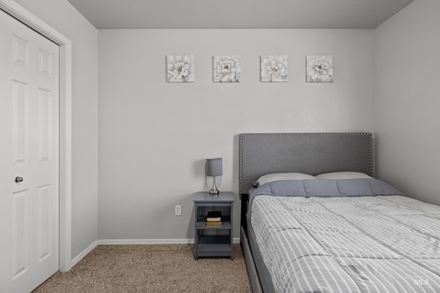 carpeted bedroom with baseboards