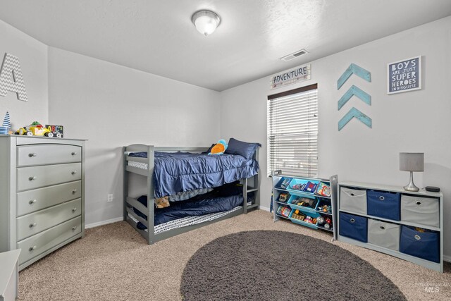 carpeted bedroom with baseboards