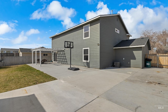 rear view of property featuring a patio area, central AC, and a pergola