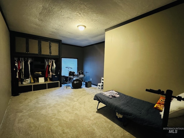 carpeted bedroom featuring a closet and a textured ceiling