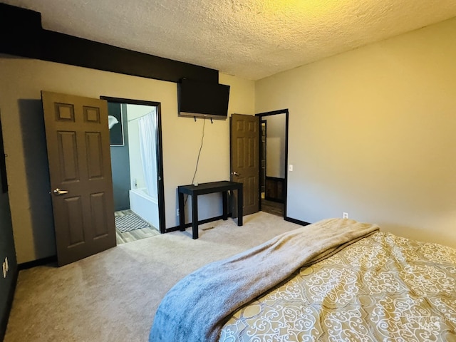 bedroom with light carpet and a textured ceiling