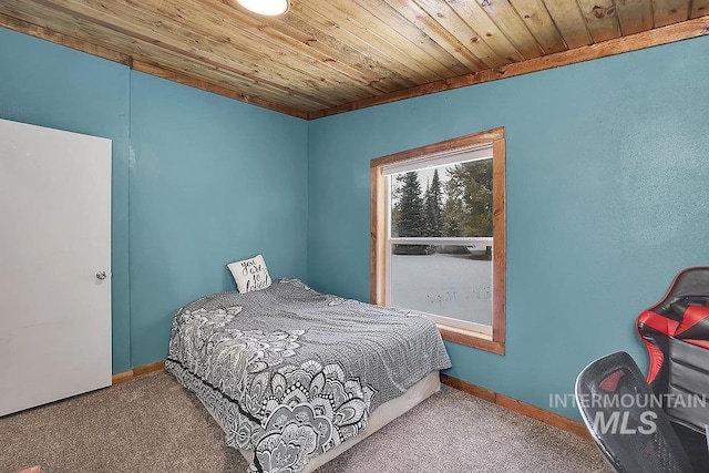 bedroom featuring carpet and wooden ceiling