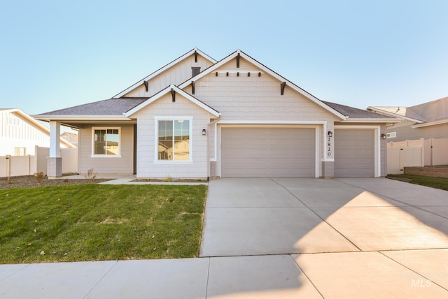 4541 E Fortuna Dr, Nampa, ID 83687 - view of front facade featuring an attached garage, driveway, and a shingled roof