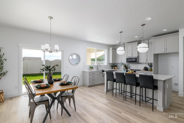 4541 E Fortuna Dr, Nampa, ID 83687 - dining room with recessed lighting, light wood-style floors, and a chandelier