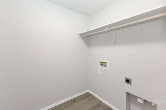 2887 N Rocky Bottom Way, Kuna, ID 83634 - laundry room with electric dryer hookup, washer hookup, wood finished floors, and baseboards