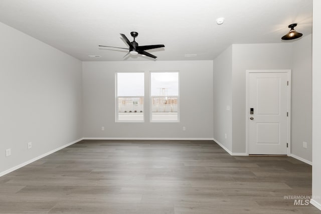 2887 N Rocky Bottom Way, Kuna, ID 83634 - unfurnished room featuring ceiling fan, wood finished floors, and baseboards