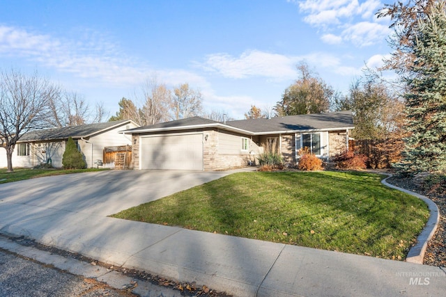 single story home featuring a garage and a front yard