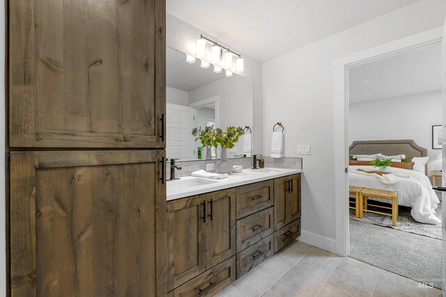 bathroom with vanity and tile patterned floors