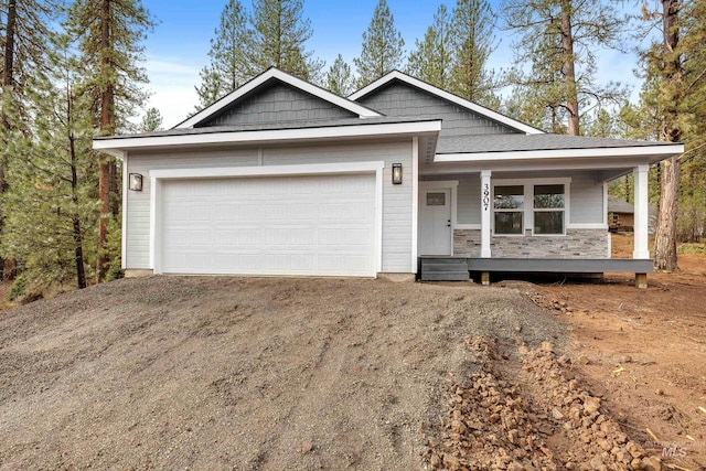 view of front of house with a garage and a porch