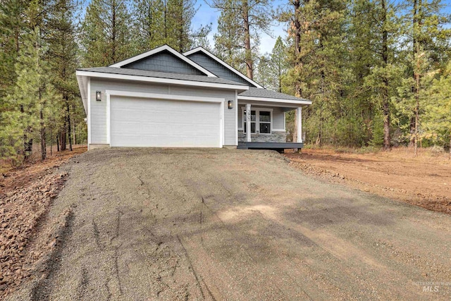 view of front of house with a garage and a porch