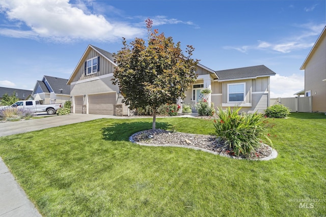 view of front facade featuring fence, a garage, a front lawn, board and batten siding, and driveway