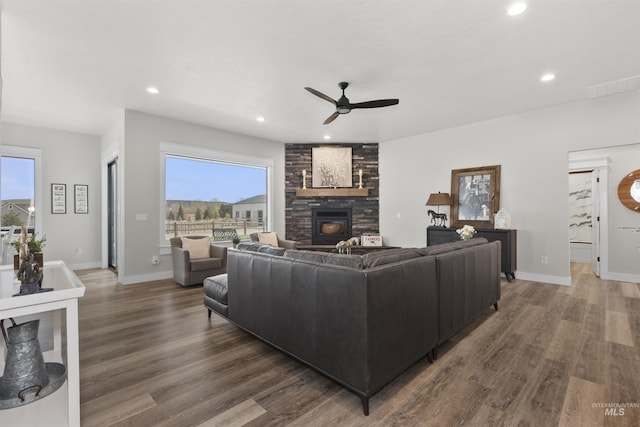518 Bass Run Ln, Marsing, ID 83639 - living area featuring a ceiling fan, wood finished floors, recessed lighting, and a stone fireplace