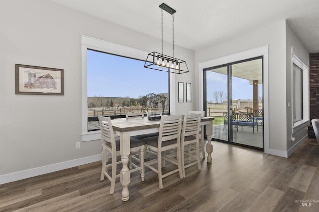 518 Bass Run Ln, Marsing, ID 83639 - dining space featuring dark wood-type flooring and a chandelier