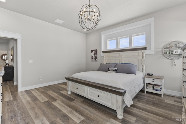 518 Bass Run Ln, Marsing, ID 83639 - bedroom featuring a chandelier and dark wood-style floors