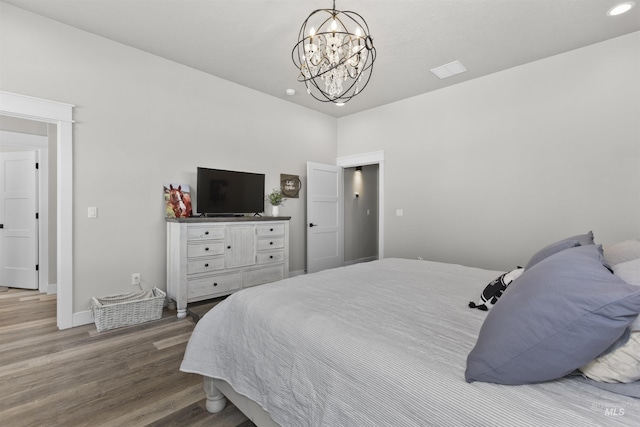 518 Bass Run Ln, Marsing, ID 83639 - bedroom featuring wood finished floors, a chandelier, and recessed lighting