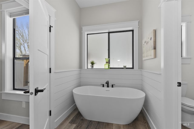 518 Bass Run Ln, Marsing, ID 83639 - bathroom featuring a soaking tub and wood finished floors