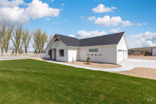518 Bass Run Ln, Marsing, ID 83639 - back of property featuring board and batten siding, driveway, and a garage
