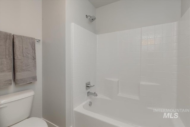 bathroom featuring shower / bathing tub combination and toilet