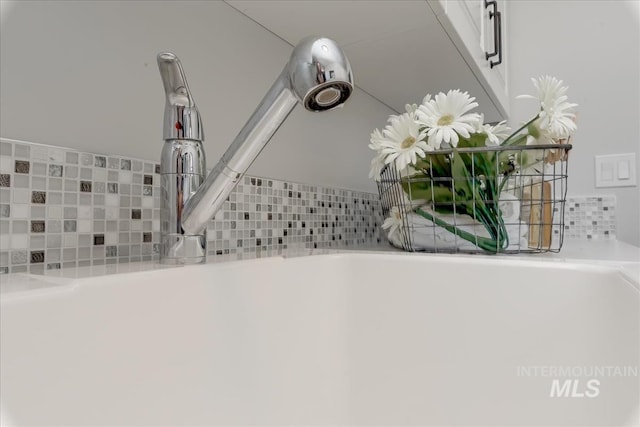 room details with decorative backsplash and sink