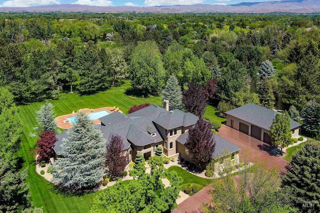 2634 W Sugarberry Dr, Eagle, ID 83616 - aerial view of property and surrounding area with a heavily wooded area