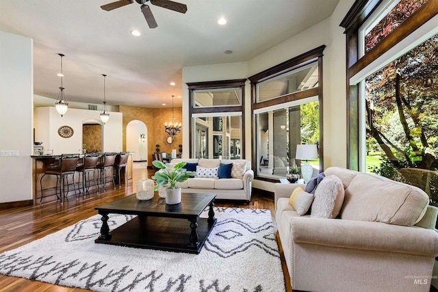 2634 W Sugarberry Dr, Eagle, ID 83616 - living area featuring arched walkways, ceiling fan, wood finished floors, recessed lighting, and baseboards
