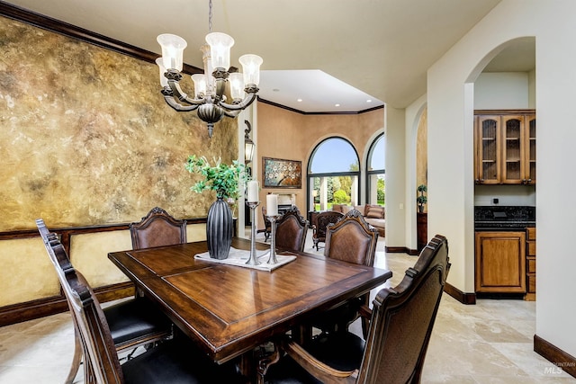2634 W Sugarberry Dr, Eagle, ID 83616 - dining room with arched walkways, baseboards, a chandelier, recessed lighting, and crown molding
