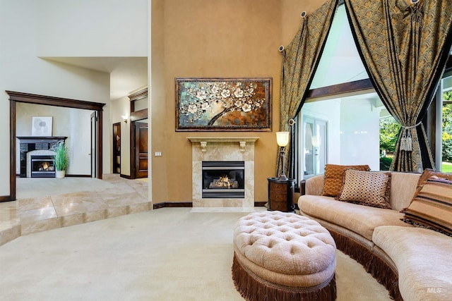 2634 W Sugarberry Dr, Eagle, ID 83616 - living room with a tile fireplace, a high ceiling, carpet flooring, and baseboards