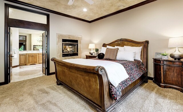 2634 W Sugarberry Dr, Eagle, ID 83616 - bedroom with light carpet, ornamental molding, baseboards, a multi sided fireplace, and ensuite bath