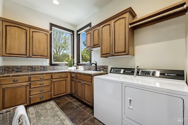 2634 W Sugarberry Dr, Eagle, ID 83616 - laundry room featuring cabinet space, washer and dryer, and dark tile patterned floors