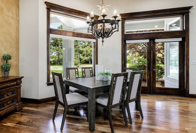 2634 W Sugarberry Dr, Eagle, ID 83616 - dining room with dark wood-style floors, a chandelier, and baseboards