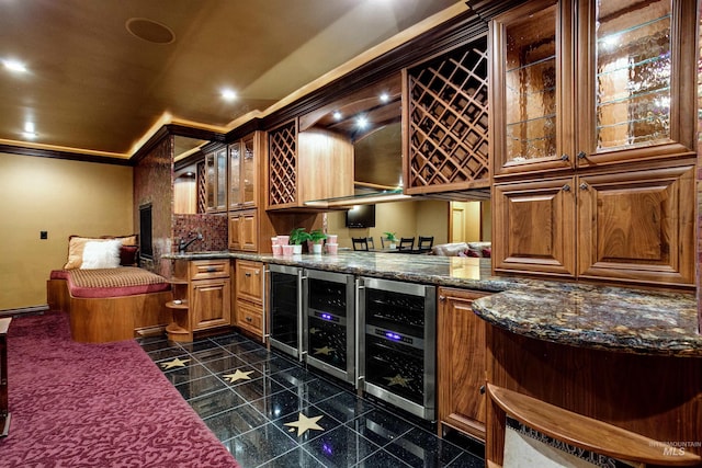 2634 W Sugarberry Dr, Eagle, ID 83616 - wine room with wine cooler, granite floors, bar with sink, and ornamental molding