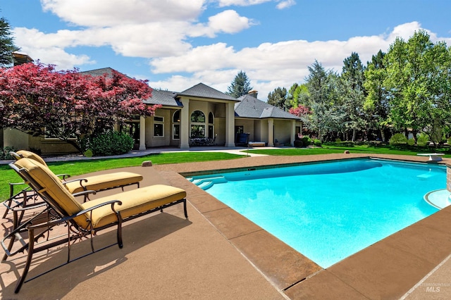 2634 W Sugarberry Dr, Eagle, ID 83616 - outdoor pool with a patio area, a diving board, and a lawn