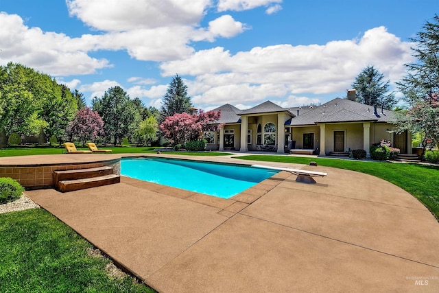 2634 W Sugarberry Dr, Eagle, ID 83616 - swimming pool featuring a patio area, a diving board, and a lawn