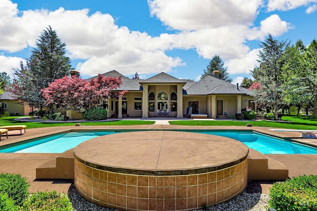 2634 W Sugarberry Dr, Eagle, ID 83616 - outdoor pool with a patio, a diving board, and an outdoor hot tub