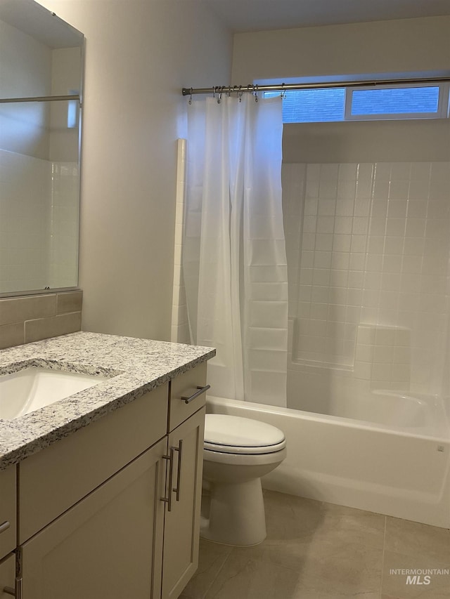 full bath with vanity, toilet, shower / bathtub combination with curtain, and tile patterned flooring