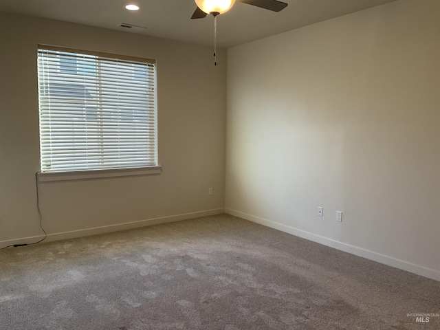 carpeted empty room with recessed lighting, baseboards, plenty of natural light, and ceiling fan