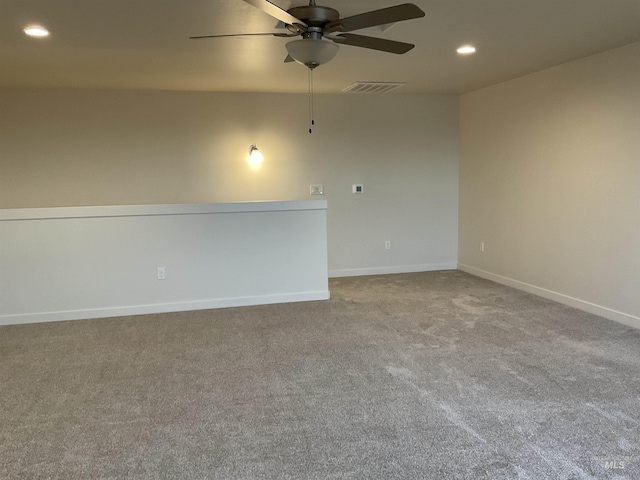 empty room featuring visible vents, recessed lighting, carpet, baseboards, and ceiling fan