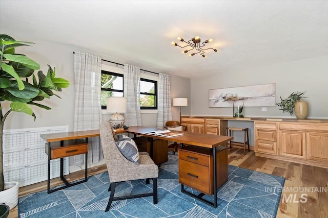 511 Keogh Ln, Caldwell, ID 83607 - office space with dark wood finished floors and a chandelier